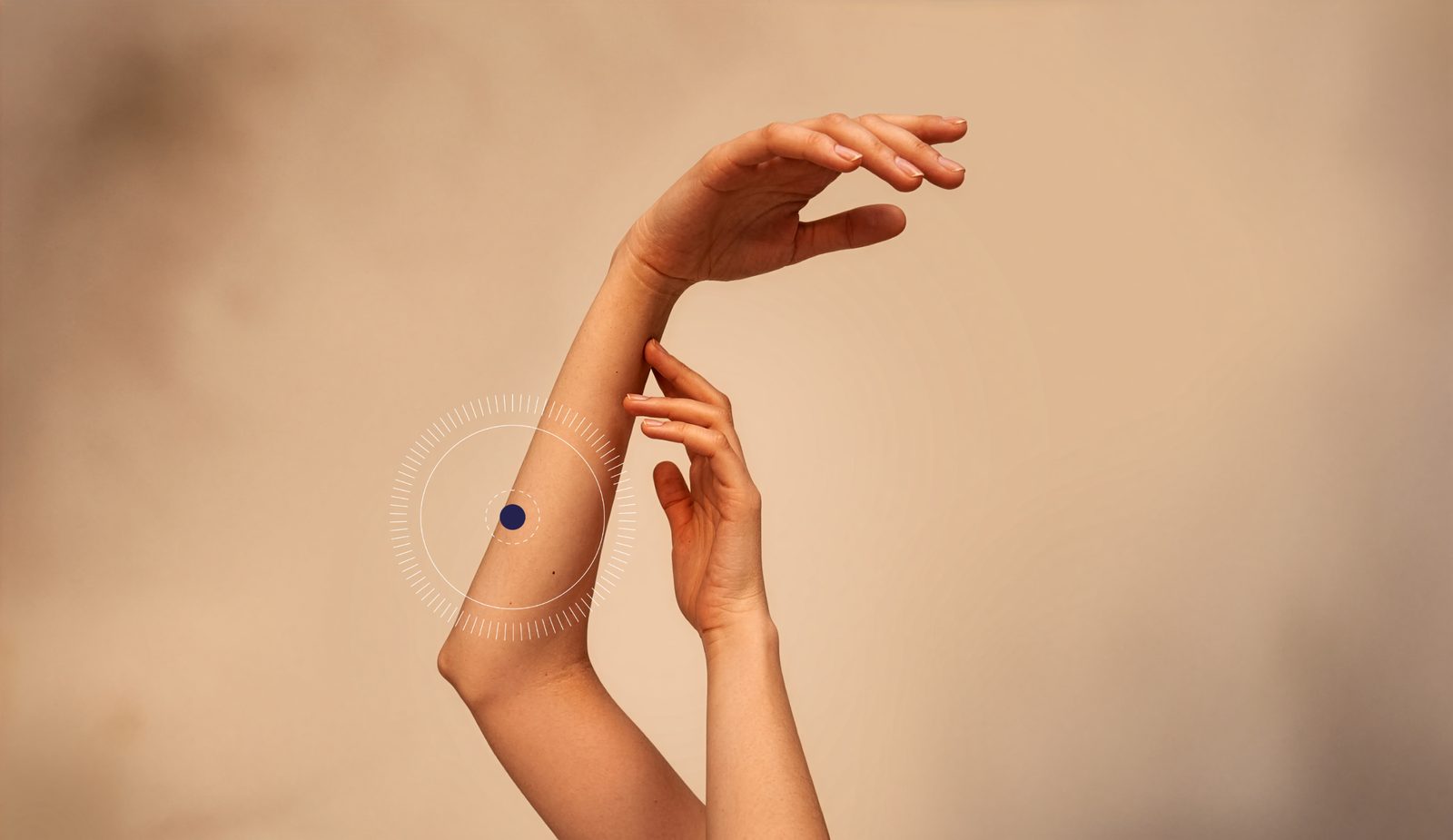 Raised arms with a highlight marker around a small spot on the forearm